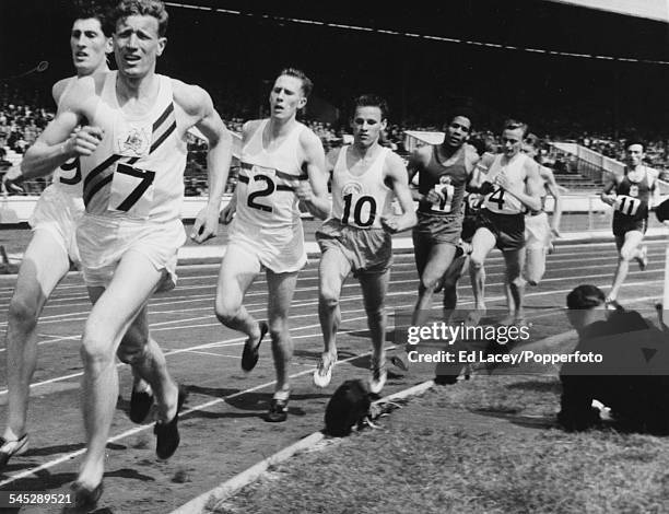 Middle distance runners Don McMillan , Don Seaman and Roger Bannister lead the field during a 1 mile international race at the Inter Counties British...