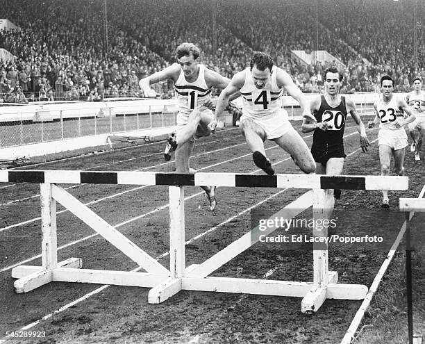 British athletes John Disley , Chris Brasher and Eric Shirley lead the pack during the 3000m steeplechase event at the Amateur Athletic Association...