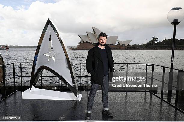 Karl Urban poses during a photo call for Star Trek Beyond on July 7, 2016 in Sydney, Australia.