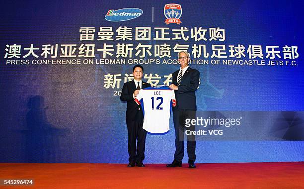 July 06: Ledman Group chairman Martin Lee and David Gallop, chief executive officer of Football Federation Australia, pose for a photo during the...
