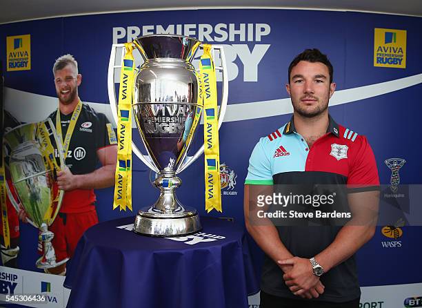 George Lowe of Harlequins poses with the Aviva Premiership Trophy during the 2016-17 Aviva Premiership Rugby Season fixtures announcement at BT Tower...