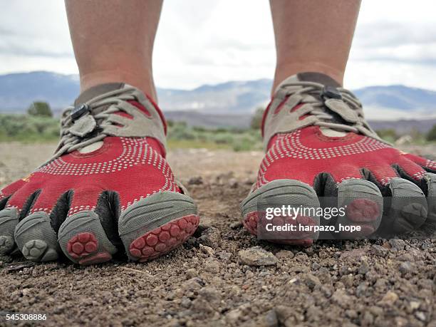 closeup of barefoot running shoes. - toe stock-fotos und bilder