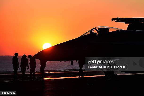 An F/A-18E Super Hornet taxis on the US navy's super carrier USS Dwight D. Eisenhower in the Mediterranean Sea on July 6, 2016. The US aircraft...