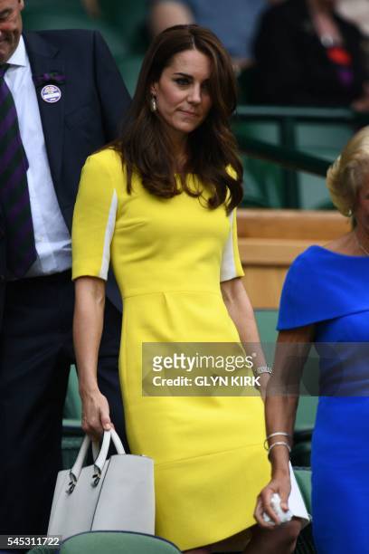 Britain's Catherine, Duchess of Cambridge arrives in the royal box on centre court during the women's semi-final matches on the eleventh day of the...
