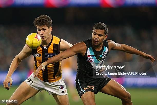 Daniel Howe of the Hawks competes with Jake Neade of the Power during the 2016 AFL Round 16 match between Port Adelaide Power and the Hawthorn Hawks...