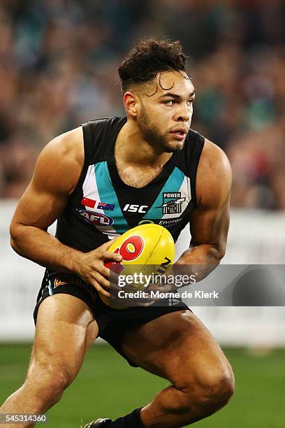 Jarman Impey of the Power wins the ball during the round 16 AFL match between the Port Adelaide Power and the Hawthorn Hawks at Adelaide Oval on July...