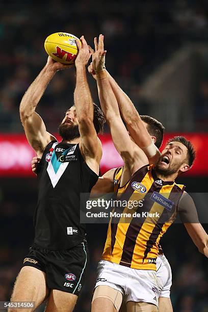 Jack Gunston of the Hawks compete for the ball with Justin Westhoff of the Power during the round 16 AFL match between the Port Adelaide Power and...