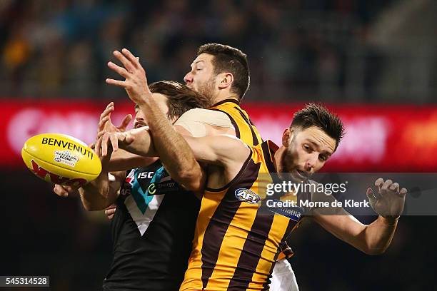 Jack Gunston of the Hawks compete for the ball with Justin Westhoff of the Power during the round 16 AFL match between the Port Adelaide Power and...