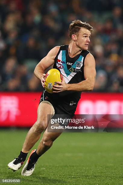 Robbie Gray of the Power runs with the ball during the round 16 AFL match between the Port Adelaide Power and the Hawthorn Hawks at Adelaide Oval on...