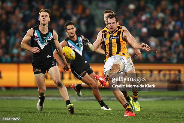 Luke Hodge of the Hawks kicks the ball during the round 16 AFL match between the Port Adelaide Power and the Hawthorn Hawks at Adelaide Oval on July...