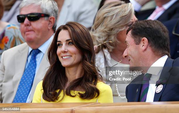 Catherine, Duchess of Cambridge and Phill Brook watch on from The Royal Box as Serena Williams of The United States faces Elena Vesnina of Russia...