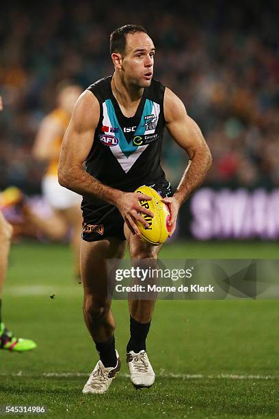 Matthew Broadbent of the Power runs with the ball during the round 16 AFL match between the Port Adelaide Power and the Hawthorn Hawks at Adelaide...