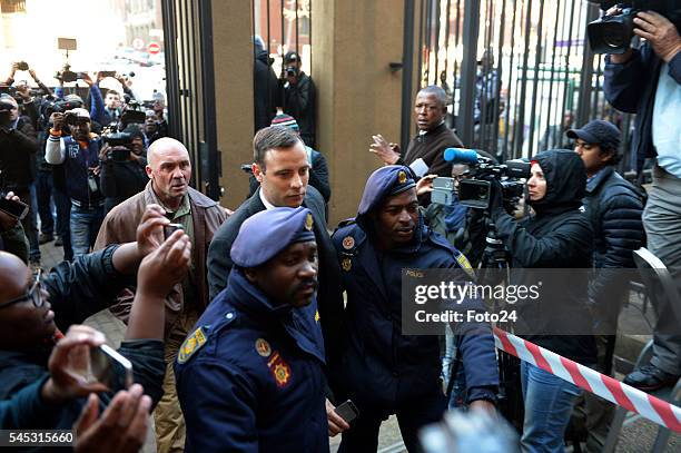 Police escort murder convicted Oscar Pistorius before his sentencing at the Northern Gauteng High Court on July 06, 2016 in Pretoria, South Africa....