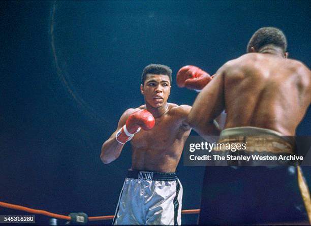 Cassius Clay and Archie Moore during the fight at the Sports Arena on November 15, 1962 in Los Angeles, California. Cassius Clay won by TKO at 1:35...