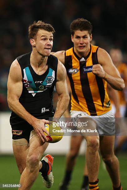 Robbie Gray of the Power runs with the ball during the round 16 AFL match between the Port Adelaide Power and the Hawthorn Hawks at Adelaide Oval on...