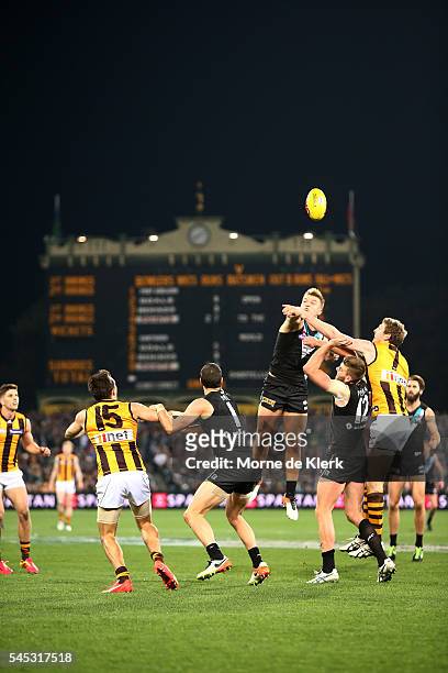 General view of play in front of the score board during the round 16 AFL match between the Port Adelaide Power and the Hawthorn Hawks at Adelaide...