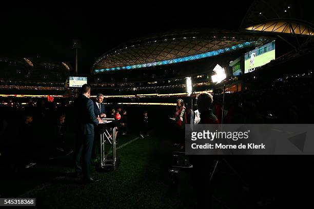 Football commentators Matthew Richardson, Wayne Carey and Bruce McAvaney of Channel 7 speak to camera before the round 16 AFL match between the Port...