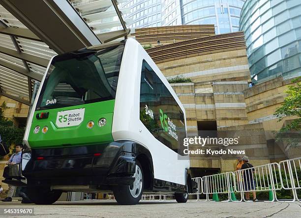 Japanese mobile internet company DeNA Co. Shows its electric driverless bus produced by EasyMile, a French driverless technology startup, in Tokyo on...
