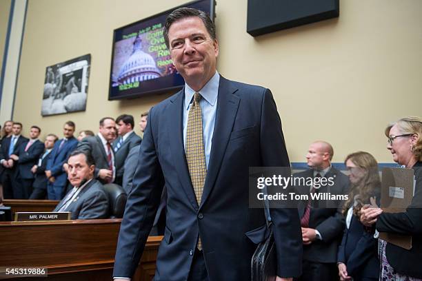 Director James Comey arrives to testify before a House Oversight and Government Reform Committee hearing in Rayburn Building on the investigation of...