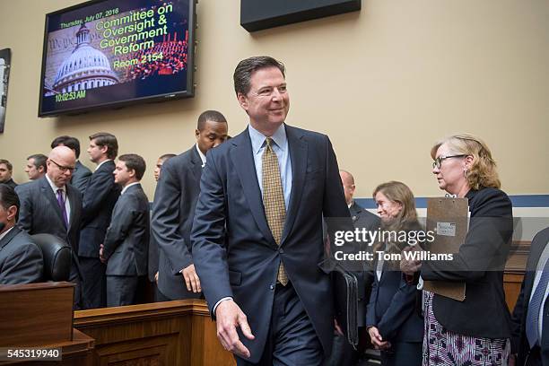 Director James Comey arrives to testify before a House Oversight and Government Reform Committee hearing in Rayburn Building on the investigation of...