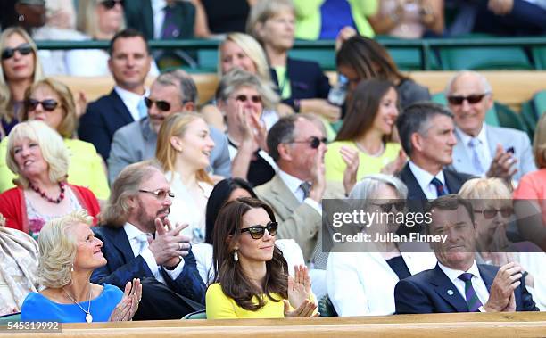 Gill Brook, Phill Brook and Catherine, Duchess of Cambridge watch on from The Royal Box on day ten of the Wimbledon Lawn Tennis Championships at the...