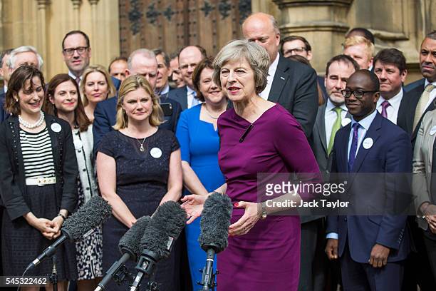British Home Secretary and Conservative leadership contender Theresa May speaks to the media in front of supporters and MPs from her party outside...