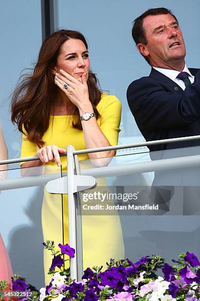 Catherine, Duchess of Cambridge and Phill Brook watch on over the outdoor courts during the Wheelchair Singles matches on day ten of the Wimbledon...