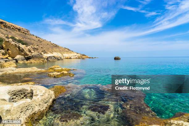 rocky coastline of gozo - gonzo stock pictures, royalty-free photos & images