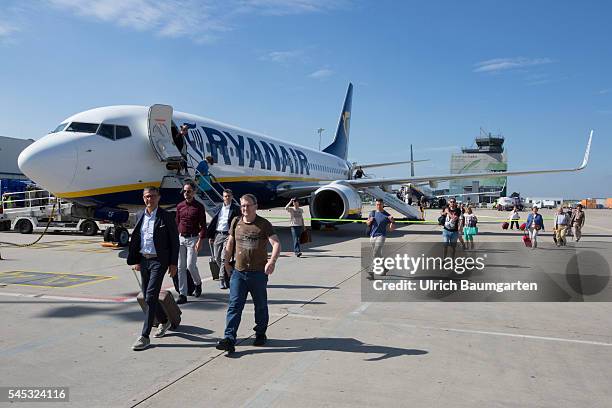 Frankfurt-Hahn Airport. Passengers board a Ryanair passenger plane.