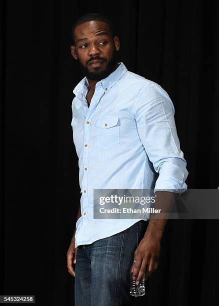 Mixed martial artist Jon Jones leaves a news conference at MGM Grand Hotel & Casino held to address being pulled from his light heavyweight title...