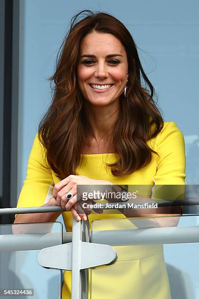 Catherine, Duchess of Cambridge watches on over the outdoor courts during the Wheelchair Singles matches on day ten of the Wimbledon Lawn Tennis...