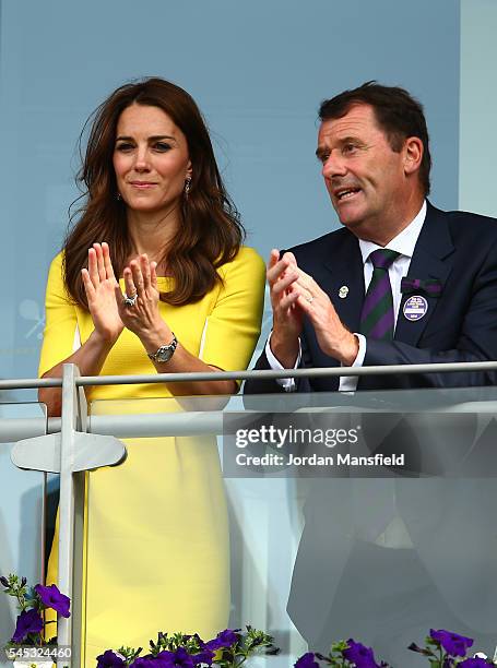 Catherine, Duchess of Cambridge and Phill Brook watch on over the outdoor courts during the Wheelchair Singles matches on day ten of the Wimbledon...