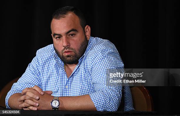 Mixed martial artist Jon Jones' manager Malki Kawa speaks during a news conference at MGM Grand Hotel & Casino to address Jones being pulled from his...