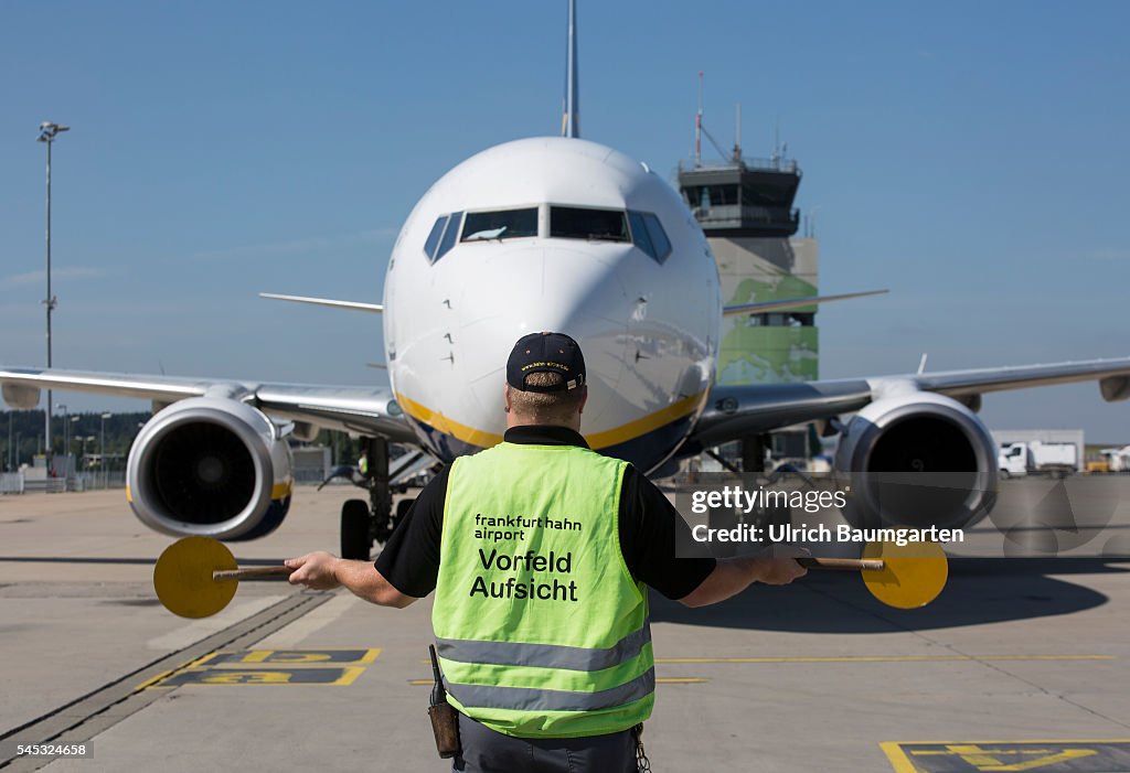 Frankfurt-Hahn Airport. Marshalling an incoming Ryanair passenger jet.
