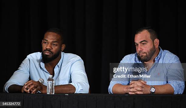 Mixed martial artist Jon Jones and his manager Malki Kawa take questions during a news conference at MGM Grand Hotel & Casino to address Jones being...