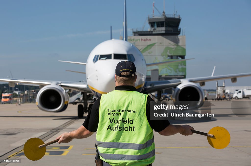 Frankfurt-Hahn Airport. Marshalling an incoming Ryanair passenger jet.
