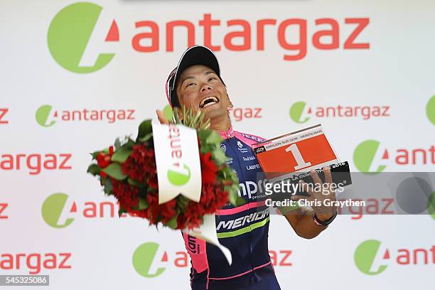 Yukiya Arashiro of Japan riding for Lampre-Merida takes the podium after being named the most aggressive rider following stage six of the 2016 Le...
