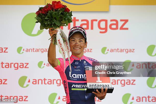 Yukiya Arashiro of Japan riding for Lampre-Merida takes the podium after being named the most aggressive rider following stage six of the 2016 Le...