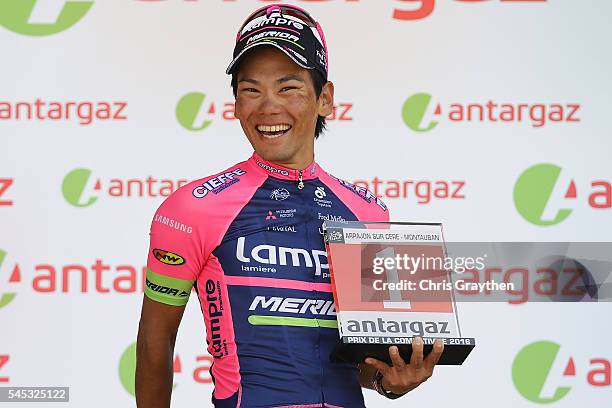 Yukiya Arashiro of Japan riding for Lampre-Merida takes the podium after being named the most aggressive rider following stage six of the 2016 Le...