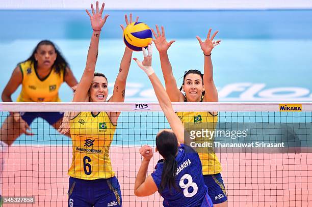 Thaisa Menezes of Brazil block the ball from Nataliya Goncharova of Russia during day two of the FIVB World Grand Prix Group 1 Final on July 7, 2016...
