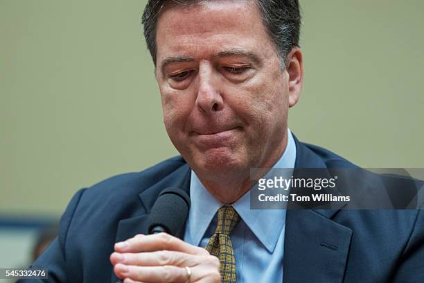 Director James Comey testifies during a House Oversight and Government Reform Committee hearing in Rayburn Building on the investigation of a private...