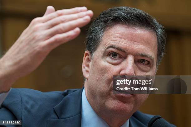 Director James Comey testifies during a House Oversight and Government Reform Committee hearing in Rayburn Building on the investigation of a private...