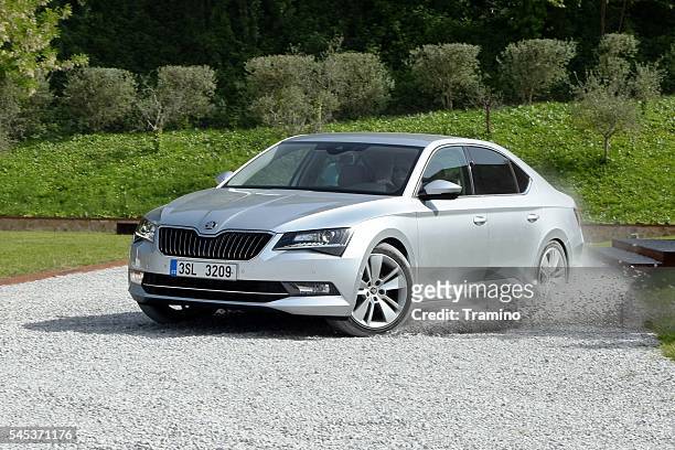 skoda superb driving on the road - skoda auto stock pictures, royalty-free photos & images