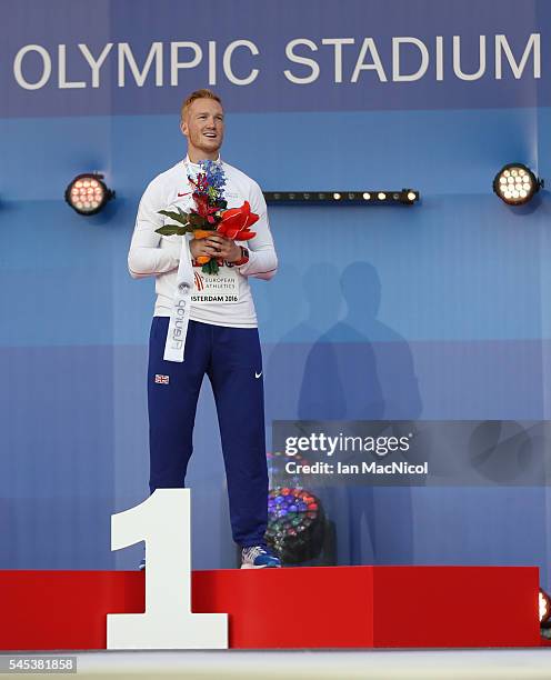 Greg Rutherford of Great Britain poses with his medal from the Men's Long Jump during Day Two of The European Athletics Championships at Olympic...