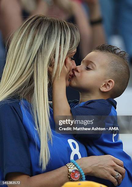 Dimitri Payet's wife Ludivine Payet looks on with their son prior to the UEFA Euro 2016 Semi Final match between Germany and France at Stade...