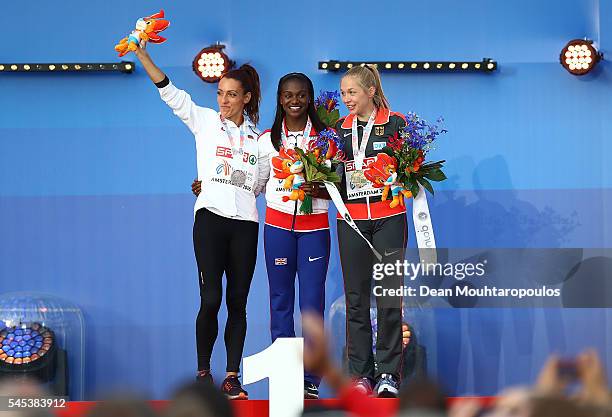 Ivet Lalova-Collio of Bulgaria , Dina Asher-Smith of Great Britain and Gina Luckenkemper of Germany pose for a picture on the podium after receiving...