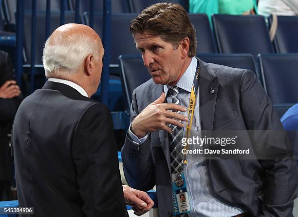 Head coach Mike Babcock of the Toronto Maple Leafs speaks to general manager Lou Lamoriello during the 2016 NHL Draft at First Niagara Center on June...