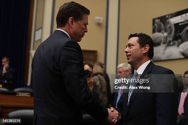 Director James Comey shakes hands with committee chairman Rep. Jason Chaffetz after a hearing before House Oversight and Government Reform Committee...