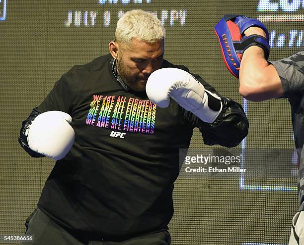 Mixed martial artist Mark Hunt hits punch mitts during an open workout for UFC 200 at T-Mobile Arena on July 7, 2016 in Las Vegas, Nevada. Hunt will...