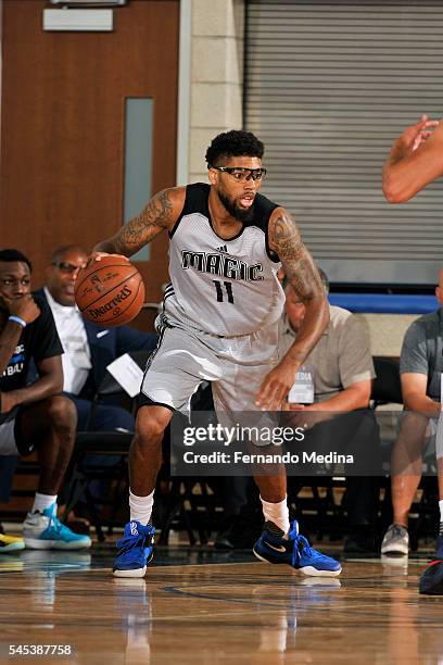 Devyn Marble of Orlando Magic Blue handles the ball during the game against the Dallas Mavericks during the 2016 NBA Orlando Summer League on July 7,...